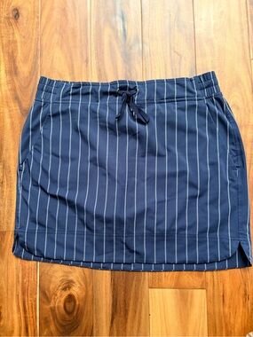 Athleta Navy Pinstripe Drawcord Mini Skirt with built in shorts underneath.